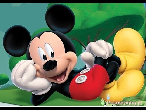 Myszka Mickey odpoczywa na zielonym tle